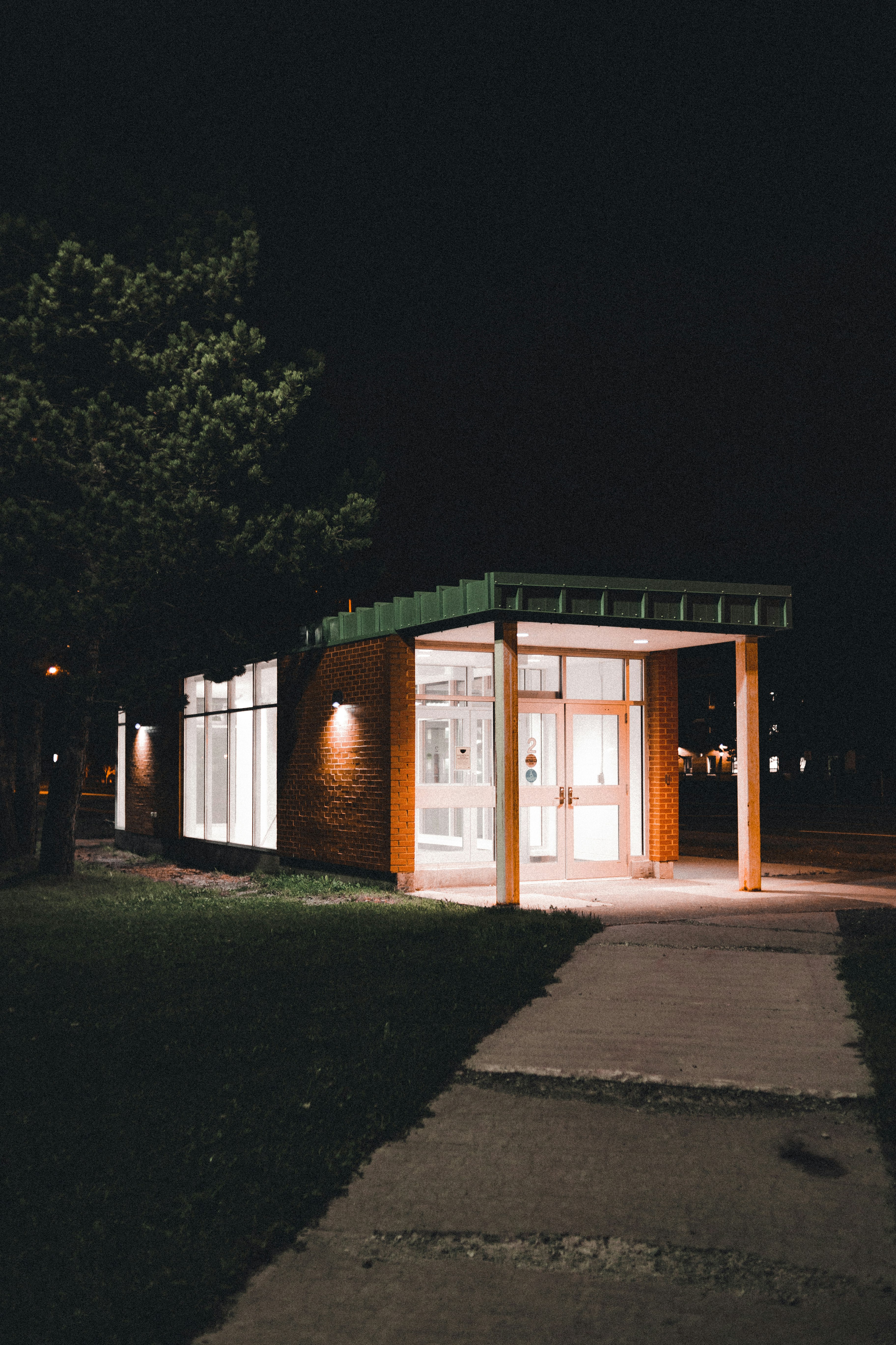 brown and white wooden house during night time